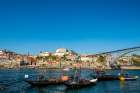 Rabelo boats near the Luis I Bridge over the Douro River, Porto, Portugal. Art Print